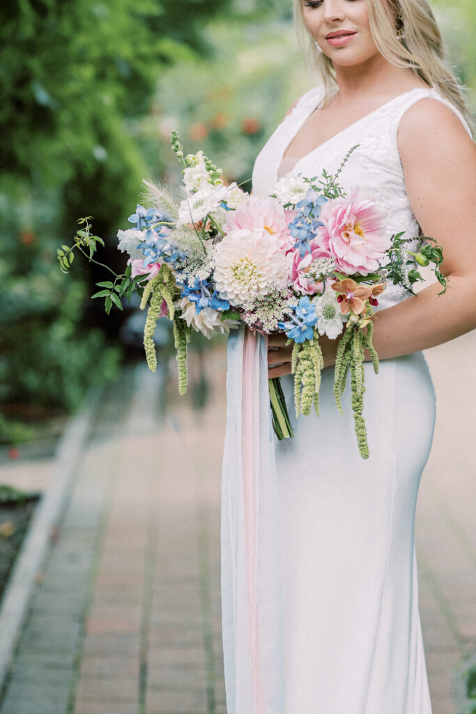 Loose locally grown bridal bouquet with dahlias, scabious and delphinium