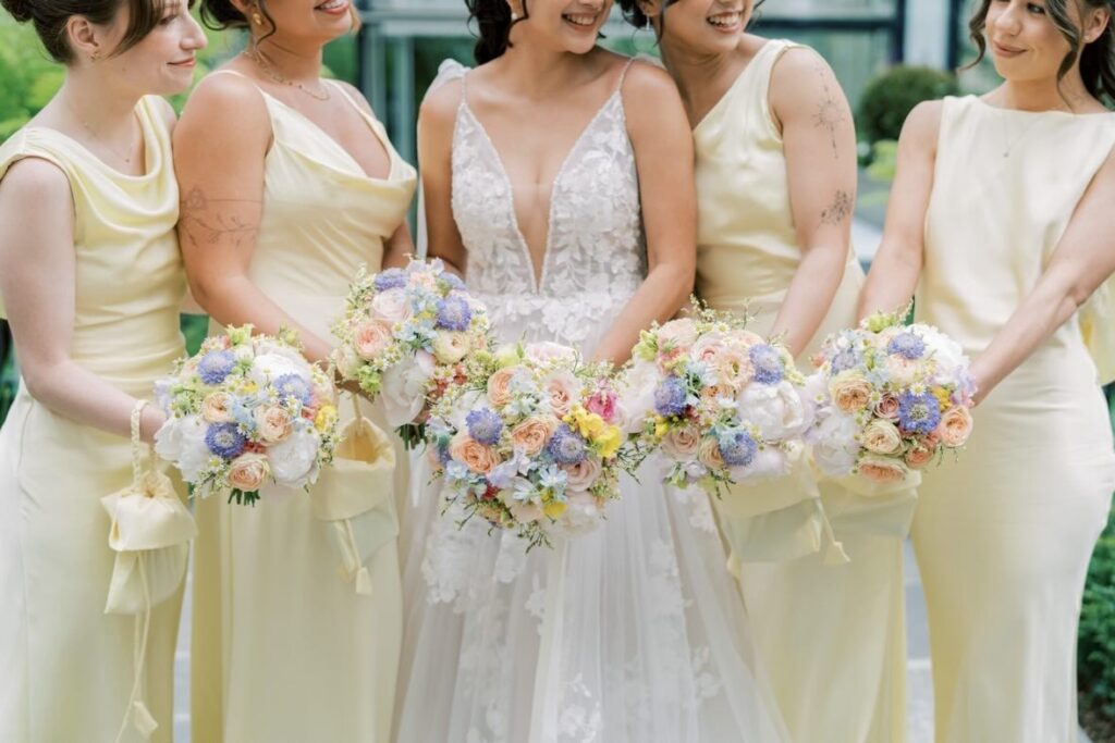 Bride and bridesmaids with pastel wedding bouquets at The Merrion Hotel Dublin