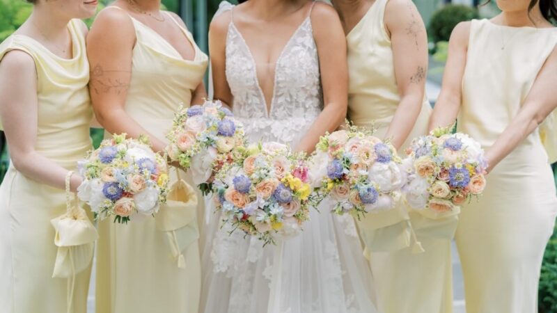 Bride and bridesmaids with pastel wedding bouquets at The Merrion Hotel Dublin