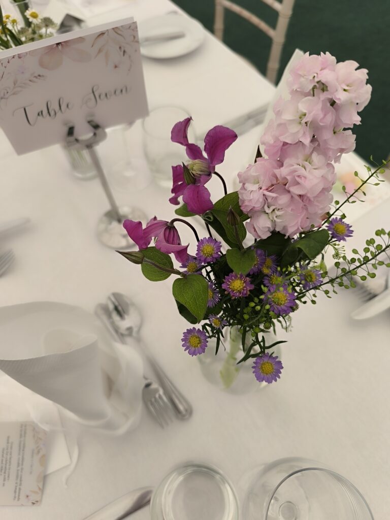 Wildflower-style table flowers at Martinstown House wedding